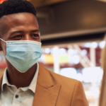 Man wearing a face mask in public space