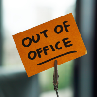 Post-it note that says out-of-office